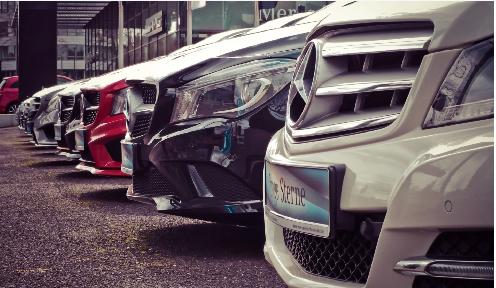Family vehicles lined up, representing auto insurance coverage